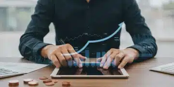 Smart Debt Consolidation: Reduce Interest Payments by 10% Person analyzing financial data on a tablet, representing smart debt consolidation and interest reduction.