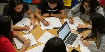 Mastering College Application Essays: Standout Strategies Students diligently writing college application essays, focused on their future.